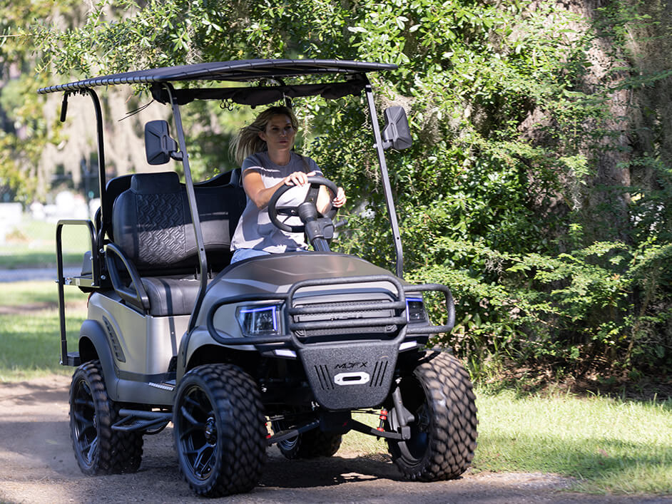 woman driving golf cart